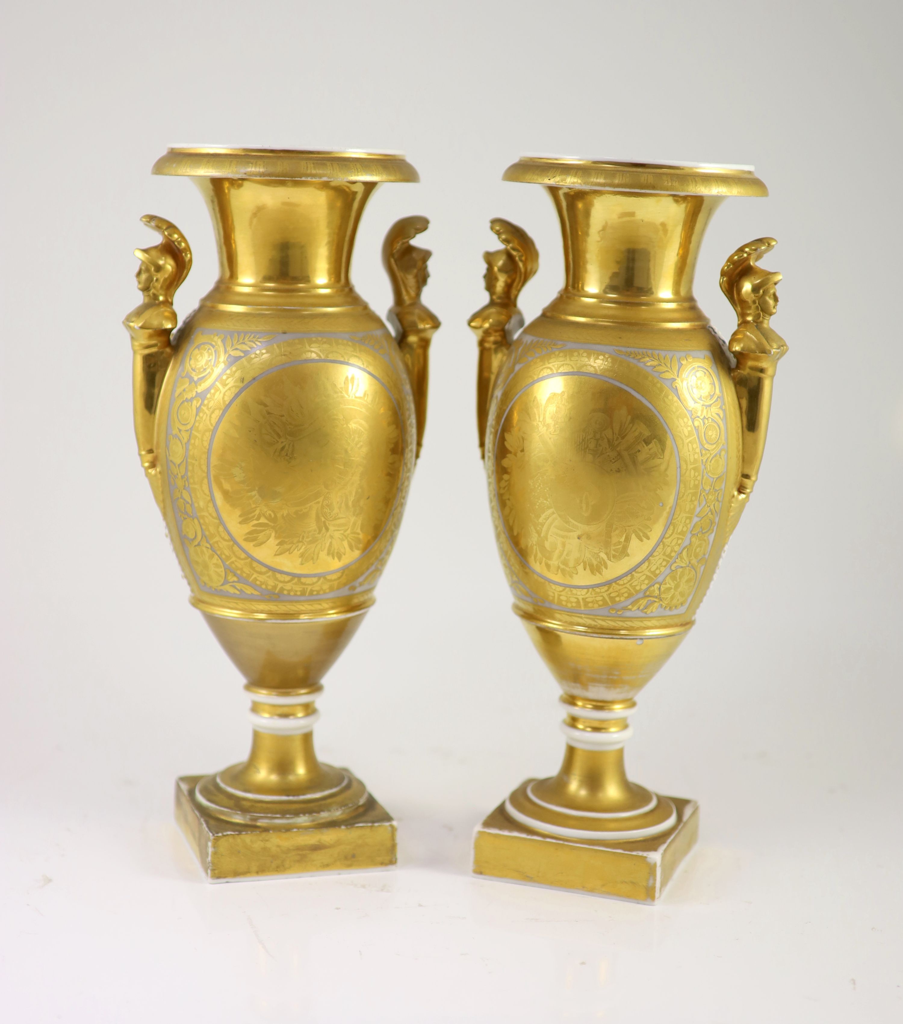 A pair of Paris porcelain vases, early 19th century, 33.5 cm high, one base restored
